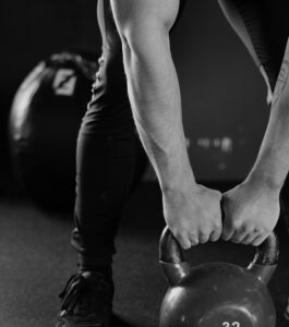 a weightlifter lifts a heavy weight